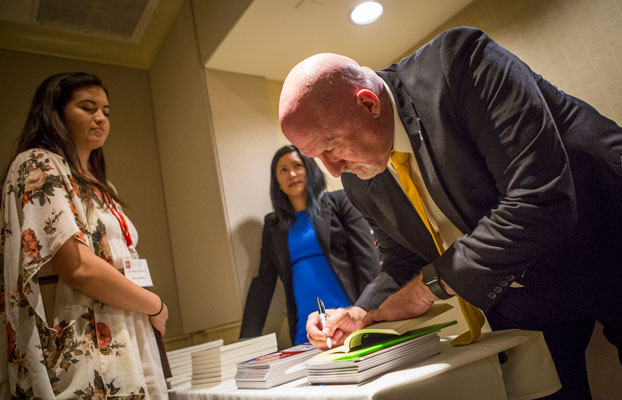 Leadership expert, Walt Grassl, signing his book